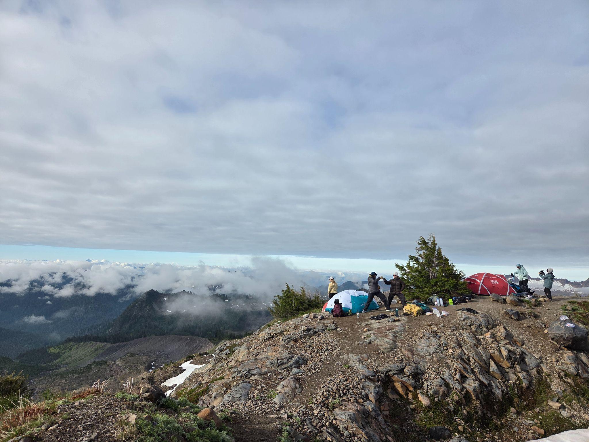 Mount Baker base camp above a cloud-filled valley