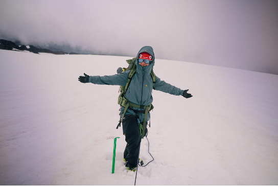 Mariam Elsharkawy standing in mountaineering gear on the Easton Glacier